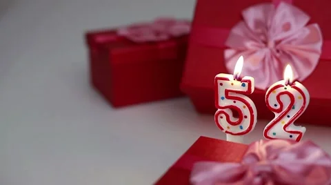 Gift boxes with number candles (52)  Stock Footage 8621726