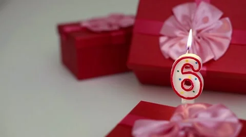 Gift boxes with number candles (6) Stock Footage 8621135