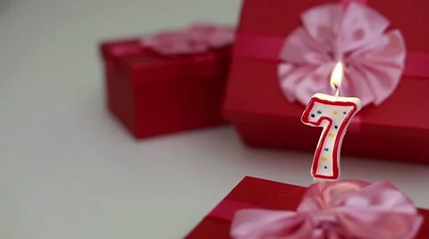 Gift boxes with number candles (7) Stock Footage