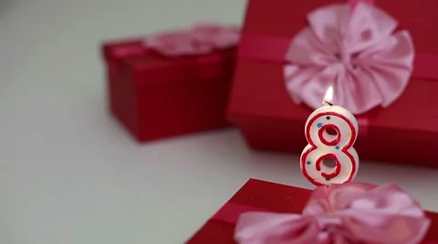 Gift boxes with number candles (8)  Stock Footage 8621168