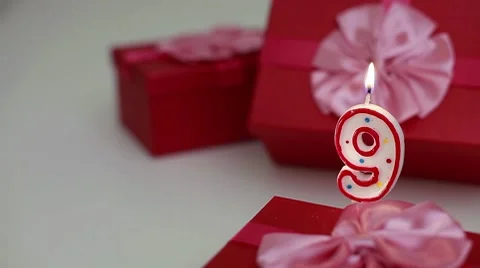 Gift boxes with number candles (9)  Stock Footage 8632679
