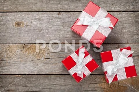 Gift boxes over wood table Stock Photos