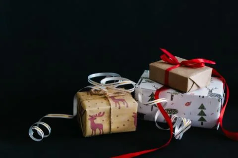 Gift boxes Packed in wrapping paper and tied with ribbons for the new year or Stock Photos