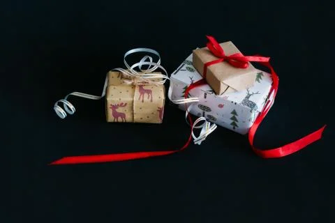 Gift boxes Packed in wrapping paper and tied with ribbons for the new year or Stock Photos