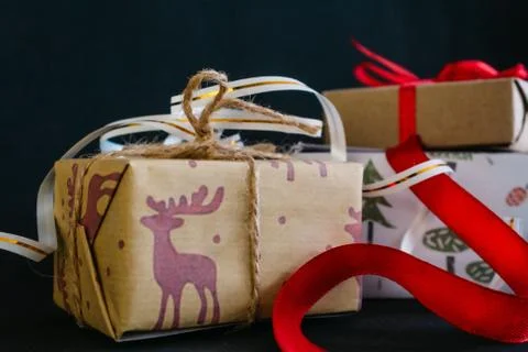 Gift boxes Packed in wrapping paper and tied with ribbons for the new year or Stock Photos