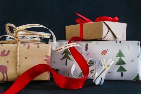 Gift boxes Packed in wrapping paper and tied with ribbons for the new year or Stock Photos