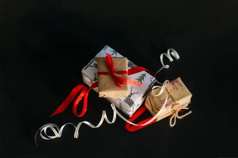 Gift boxes Packed in wrapping paper and tied with ribbons for the new year or Stock Photos
