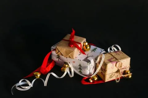 Gift boxes Packed in wrapping paper and tied with ribbons for the New year or Stock Photos