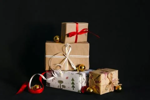 Gift boxes Packed in wrapping paper and tied with ribbons for the New year or Stock Photos