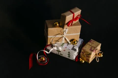 Gift boxes Packed in wrapping paper and tied with ribbons for the New year or Stock Photos