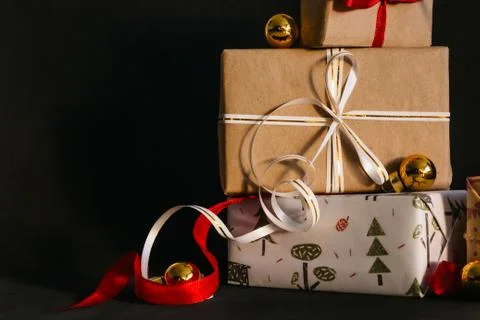 Gift boxes Packed in wrapping paper and tied with ribbons for the New year or Stock Photos