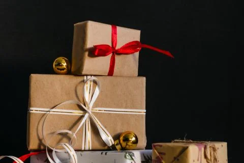 Gift boxes Packed in wrapping paper and tied with ribbons for the New year or Stock Photos