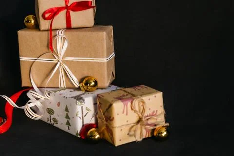 Gift boxes Packed in wrapping paper and tied with ribbons for the New year or Stock Photos