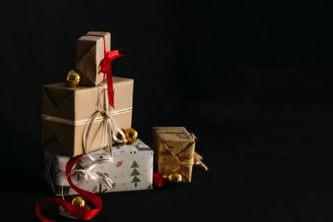Gift boxes Packed in wrapping paper and tied with ribbons for the New year or Stock Photos