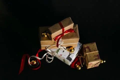 Gift boxes Packed in wrapping paper and tied with ribbons for the New year or Stock Photos