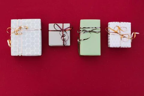 Gift boxes on a red background Stock Photos