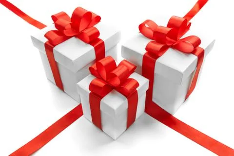 Gift boxes with red ribbon bow isolated on white background Stock Photos