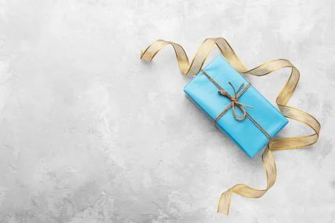 Gift boxes with ribbon Gift boxes wrapped in blue craft paper, with gold r... Stock Photos