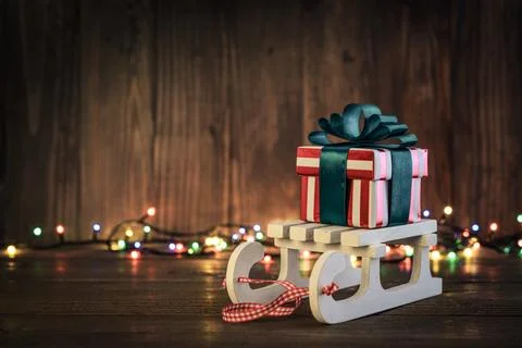 Gift boxes with ribbons on sled Foto stock