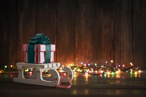 Gift boxes with ribbons on sled Stock Photos