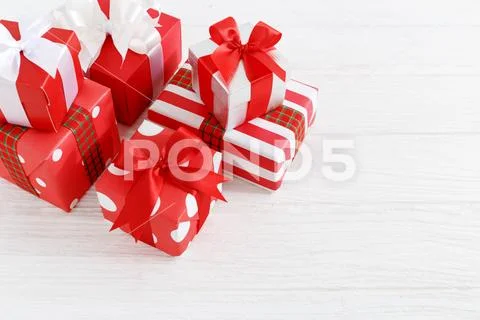 Gift boxes with ribbons on wood table background Stock Photos