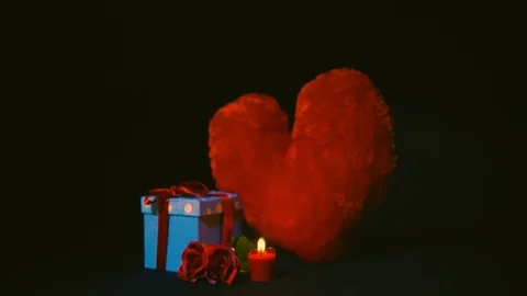 Gift boxes, rose, candle burning and pillow love. Footage of valentine Stock Footage 102063826
