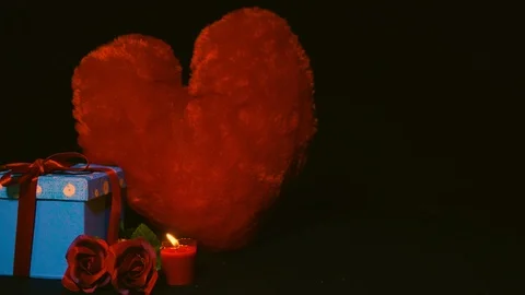 Gift boxes, rose, candle burning and pillow love. Footage of valentine Stock Footage 102066464