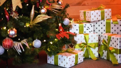Gift boxes on sheepskin at christmas tree Video stock 101318945