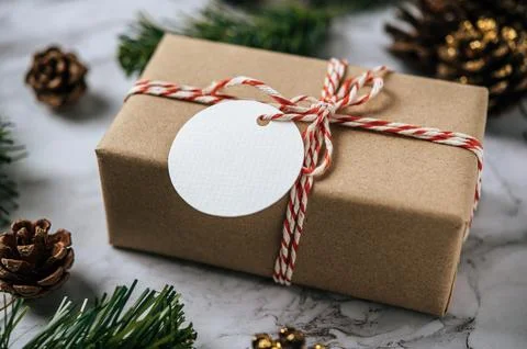 Gift boxes with small gifts on white cement Фото