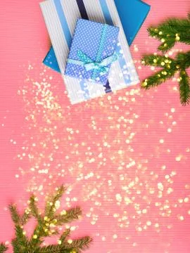 Gift boxes stack on pink background with glitter Stock Photos