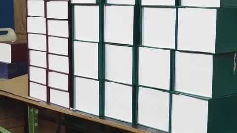 Gift boxes stacked on dark background, light effect Stock Footage 83794507