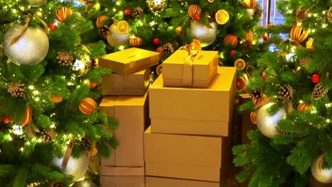 Gift boxes under beautiful decorated Christmas tree. Ornaments, decorations a Stock Footage 219891237