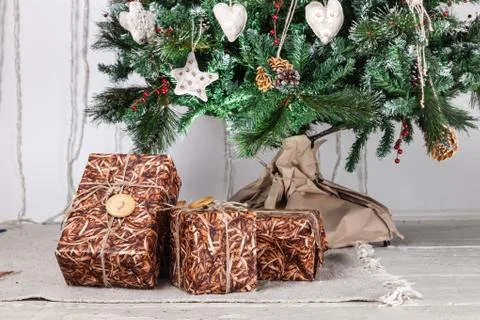 Gift boxes under christmas tree Stock Photos