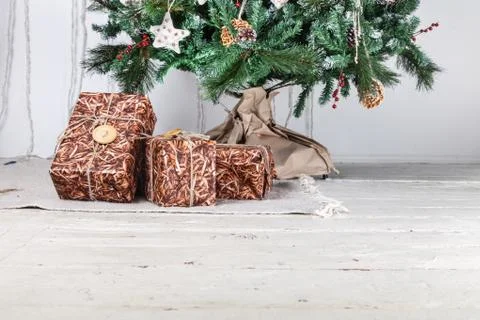 Gift boxes under christmas tree Stock Photos