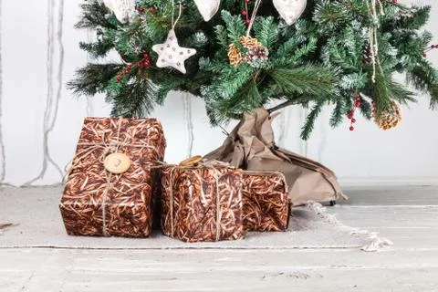 Gift boxes under christmas tree Stock Photos