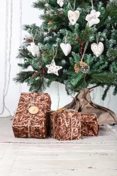 Gift boxes under christmas tree Stock Photos