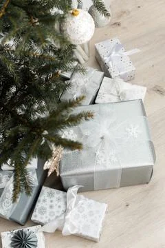 Gift boxes under the Christmas tree Stock Photos