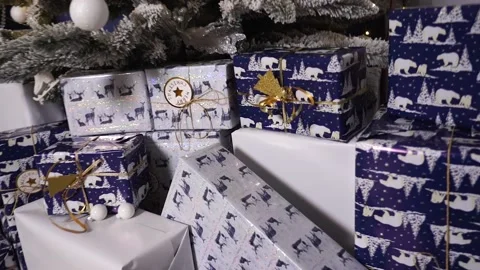 Gift boxes under the tree. Christmas presents. Gifts for the New Year. Stock Footage 166003811