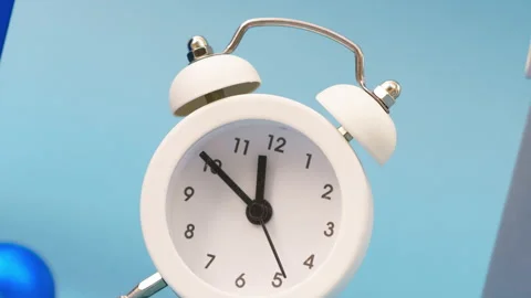 Gift boxes with a white alarm clock on a blue background, live greeting card Stock Footage 160271102