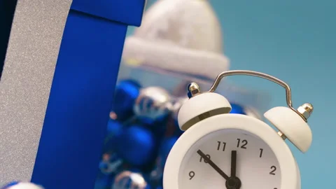 Gift boxes with a white alarm clock on a blue background, live greeting card Stock Footage 160848212