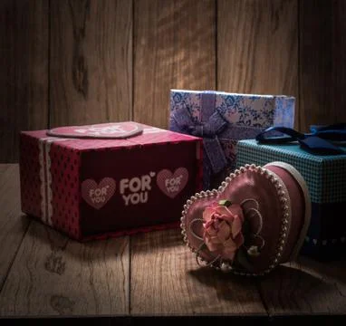 Gift boxes in wooden box Stock Photos