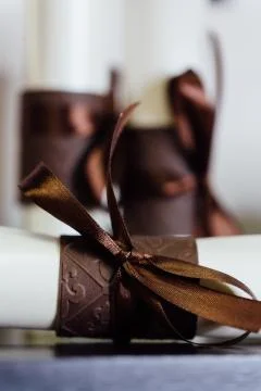Gift Certificate , three close up of paper scroll with brown ribbon. Foto stock