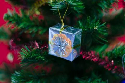 Gift on christmas tree Stock Photos