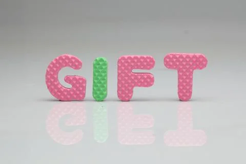 GIFT in colorful foam on a white background Stock Photos