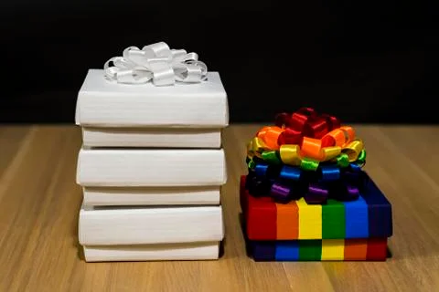 Gift composition. Box with stripes of different colors. Multi-colored bow Stock Photos