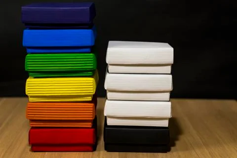 Gift composition. Boxes of different colors on the left. On the right are white Foto stock
