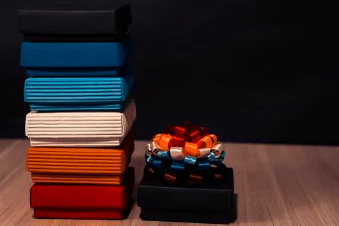 Gift composition. Boxes of different colors on the left. On the right is a black Stock Photos