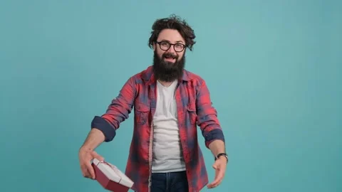 Gift delivery. Smiling man offering wrapped box to camera. Stock Footage 142073136
