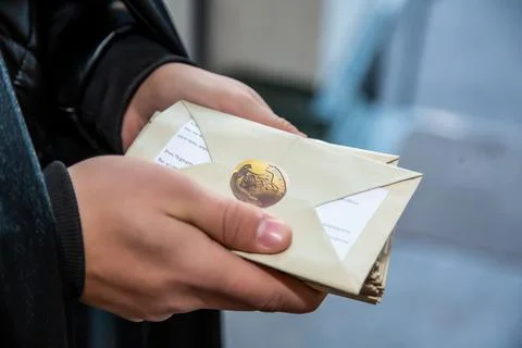 Gift envelope in a man's hands Stock Photos