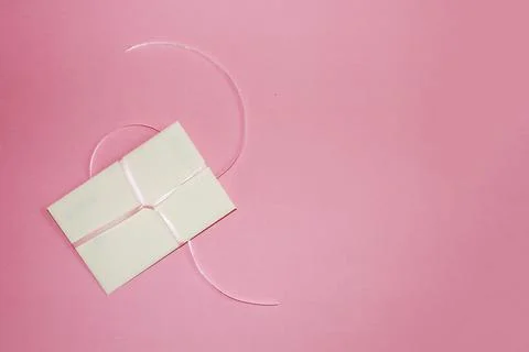 Gift envelope on pink background copy space Stock Photos